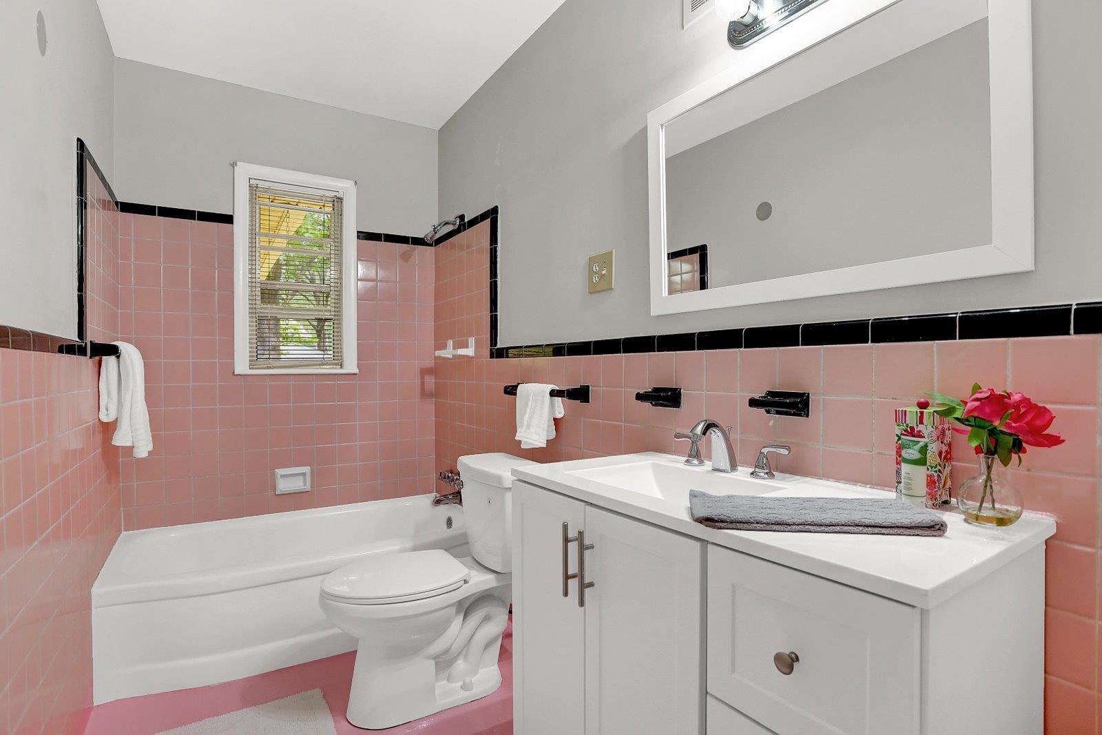 4892 Amboy Road Memphis, TN 38117 - Photo 23 of 26 a bathroom with a sink a toilet and a mirror