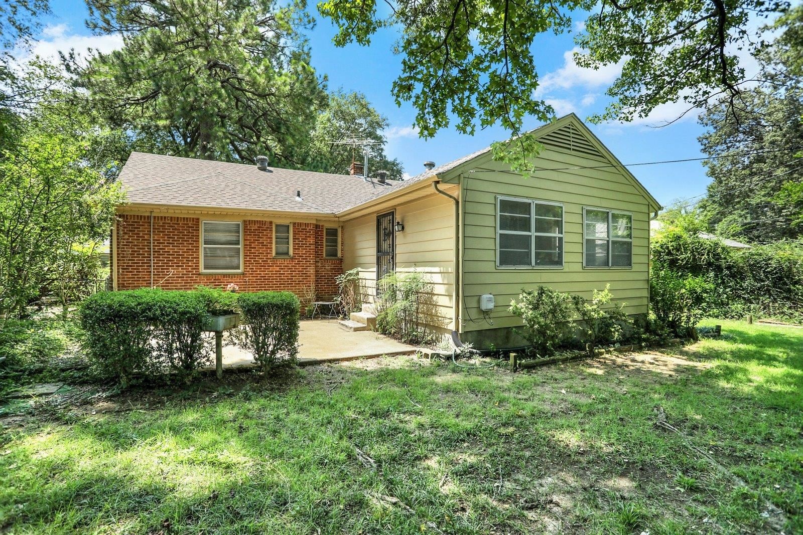 4892 Amboy Road Memphis, TN 38117 - Photo 24 of 26 a view of a house with a yard and plants