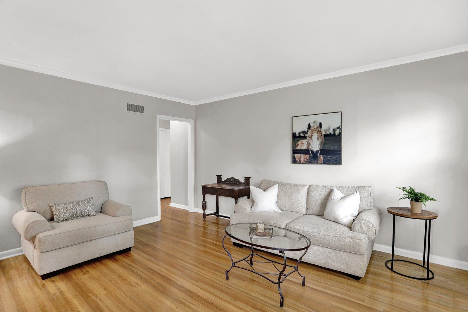 4892 Amboy Road Memphis, TN 38117 - Photo 3 of 26 a living room with furniture and a wooden floor