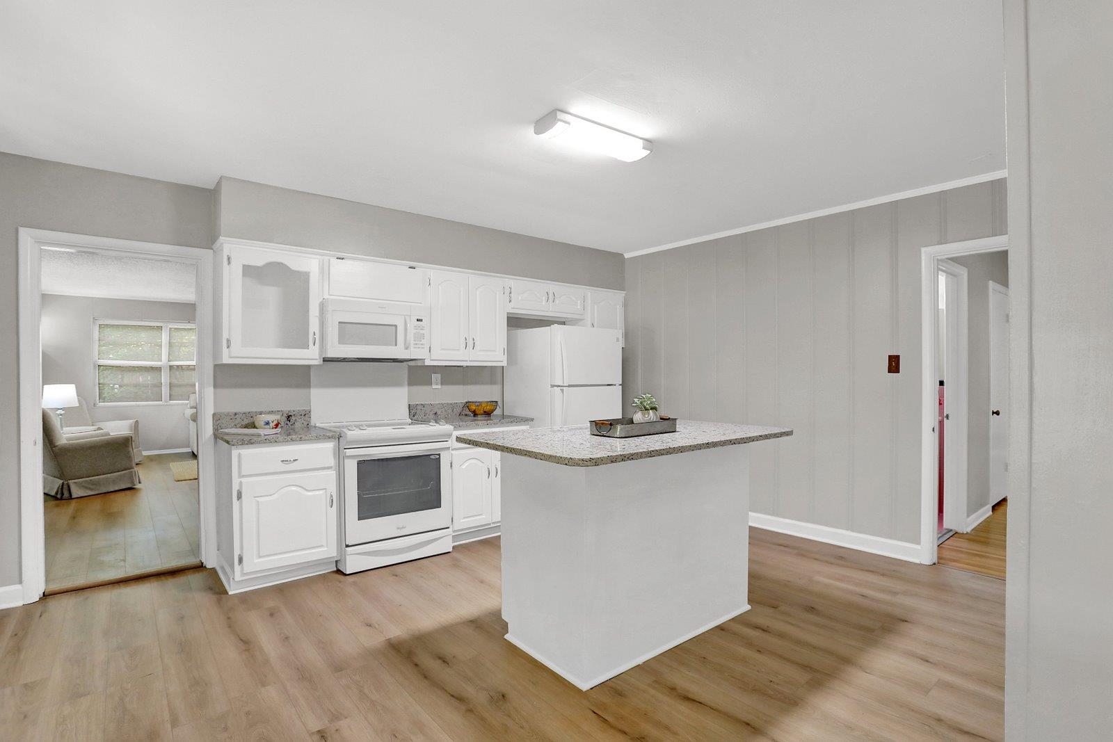 4892 Amboy Road Memphis, TN 38117 - Photo 8 of 26 a kitchen with a stove top oven and cabinets