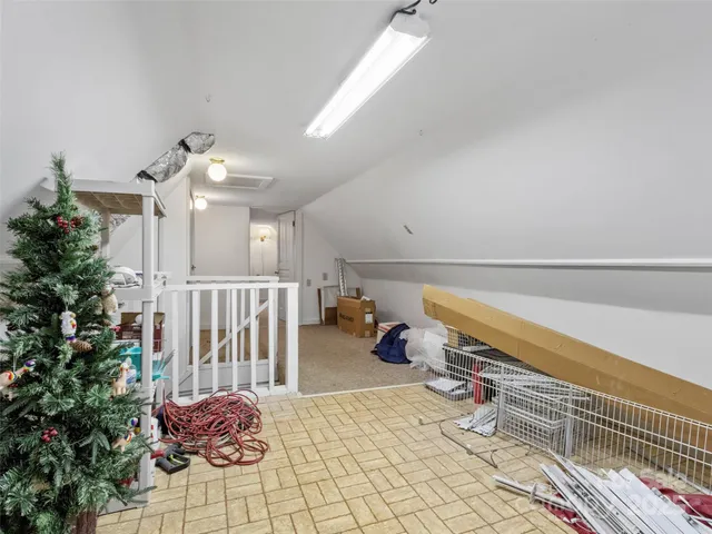 an empty room with a empty space and windows