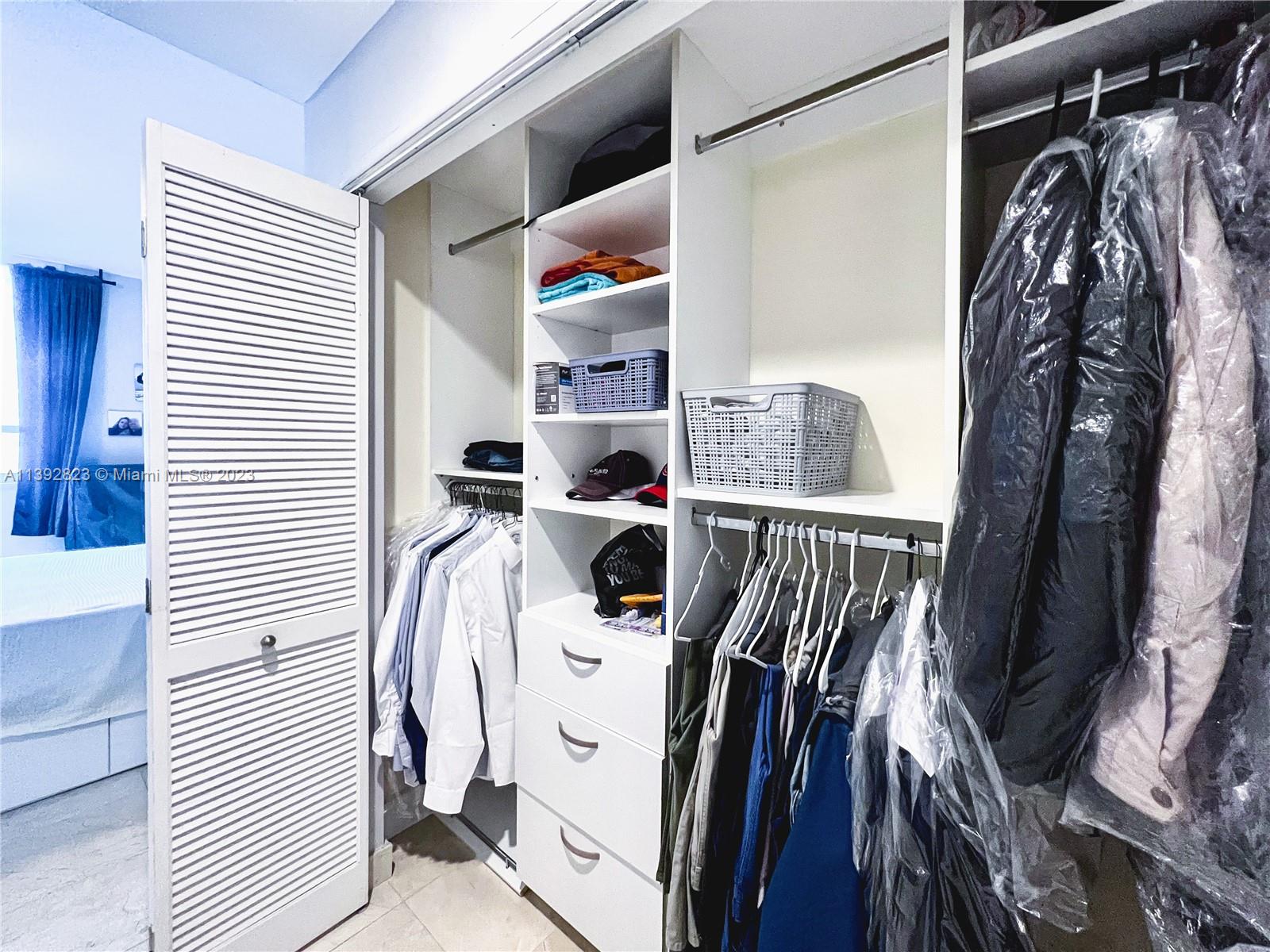 Brickell Miami, FL 33131 - Photo 17 of 50 a view of walk in closet with clothes and shoes