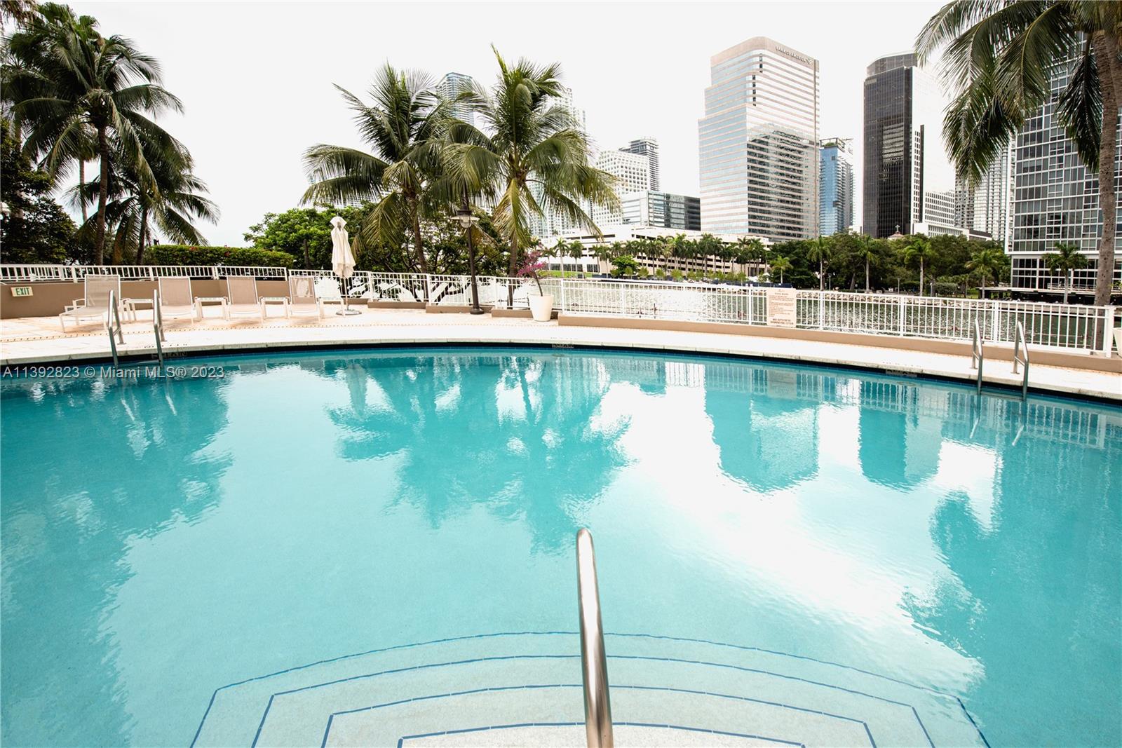 Brickell Miami, FL 33131 - Photo 38 of 50 a view of swimming pool with outdoor seating and lake view