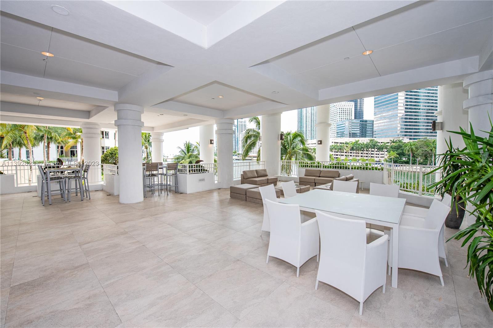 Brickell Miami, FL 33131 - Photo 39 of 50 a living room with fireplace furniture and a large window