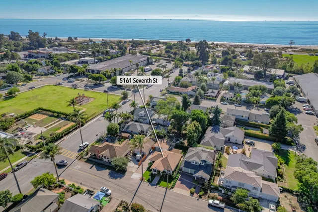 a view of balcony with wooden floor and fence