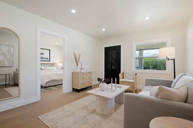 a living room with furniture and a table