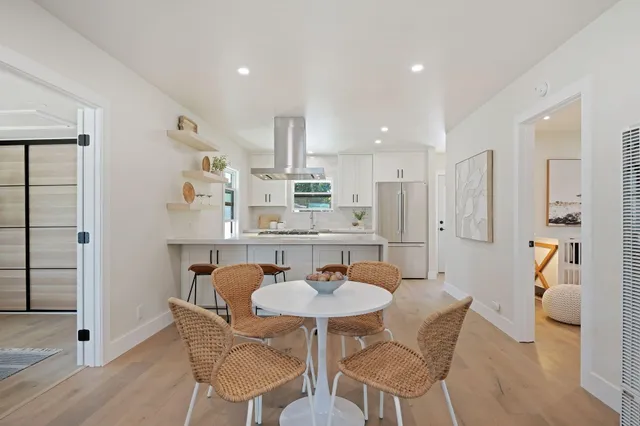 a kitchen with a stove a refrigerator and a refrigerator