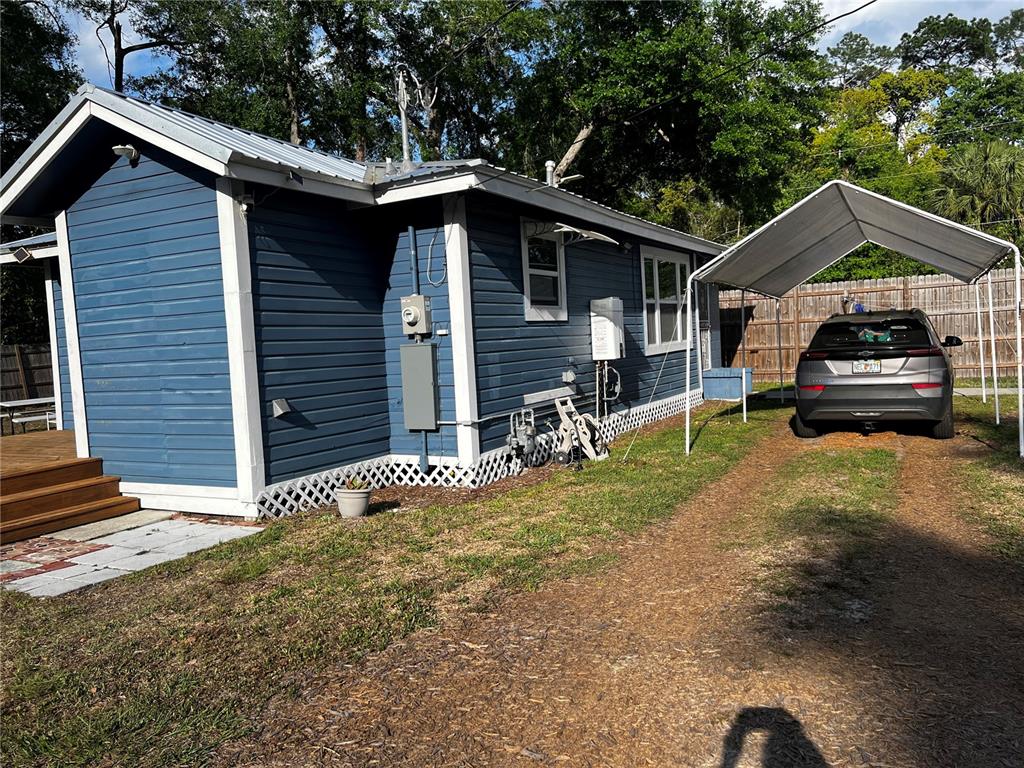 408 Northeast 18th Street Gainesville, FL 32641 - Photo 1 of 8 a house view with a backyard space