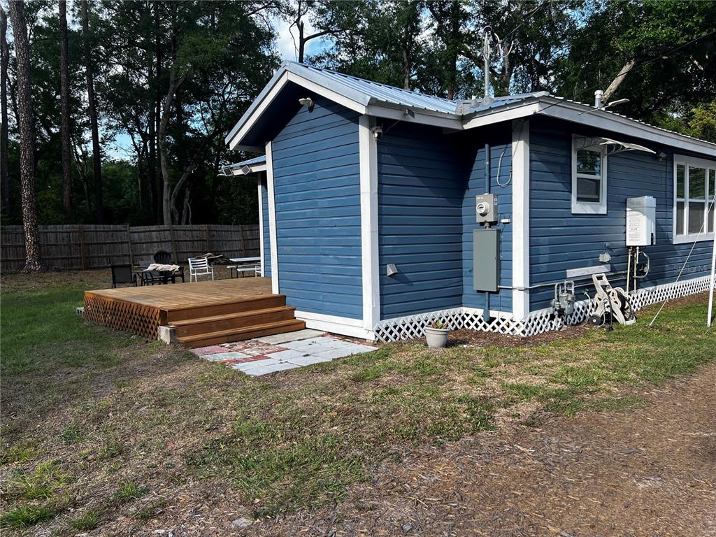 408 Northeast 18th Street Gainesville, FL 32641 - Photo 7 of 8 a view of a house with a yard patio and a garden