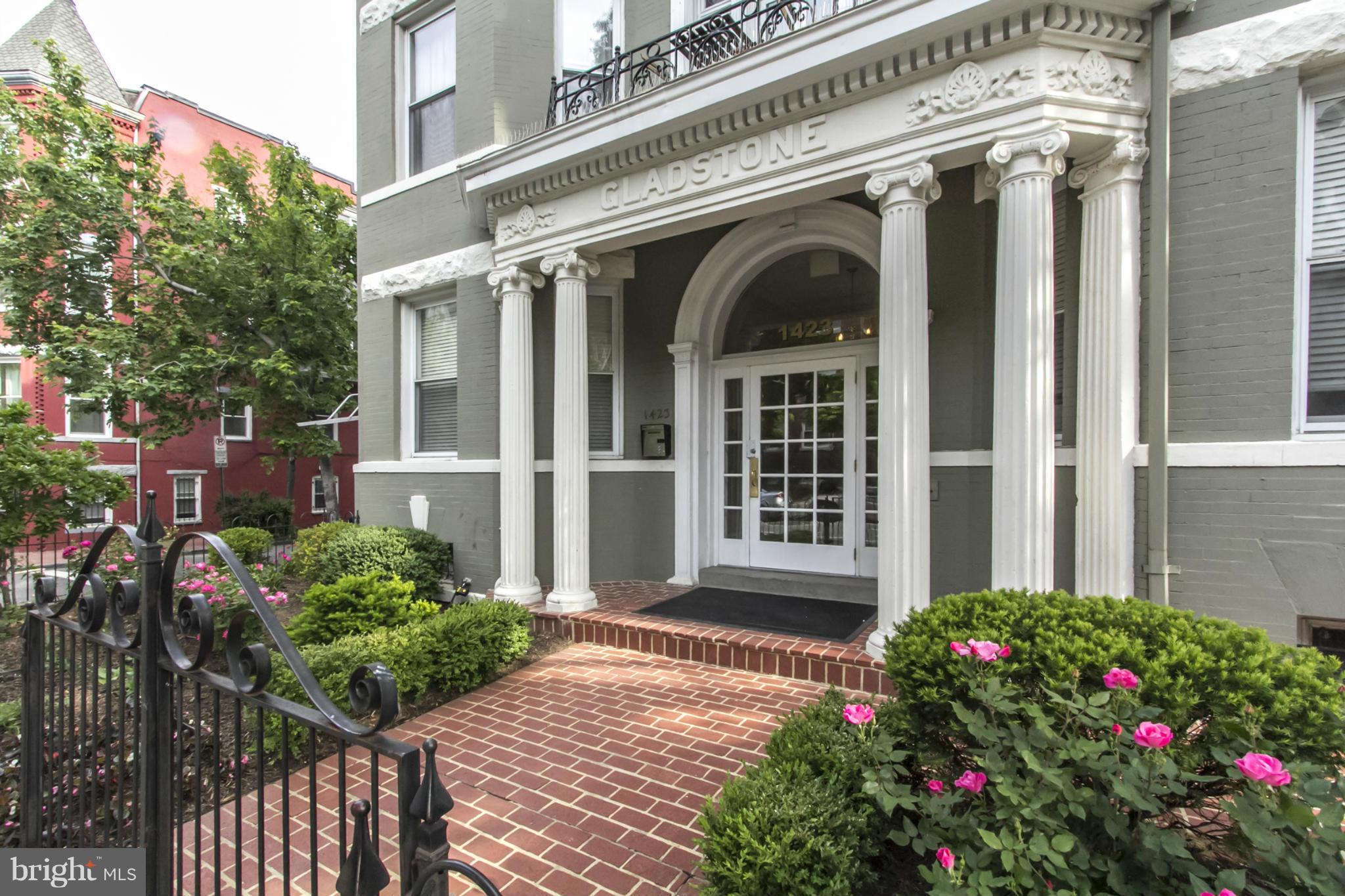 1423 R Street Northwest, Unit 505 Washington, DC 20009 - Photo 2 of 22 a view of a house with large windows and flower plants