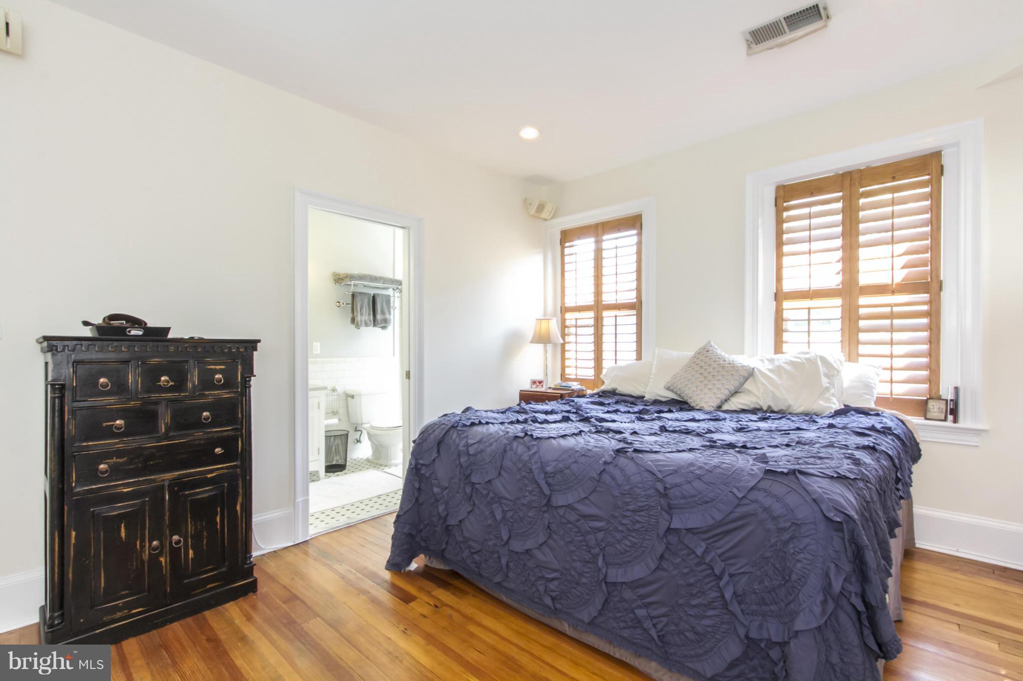 1423 R Street Northwest, Unit 505 Washington, DC 20009 - Photo 13 of 22 a bedroom with a bed and a television