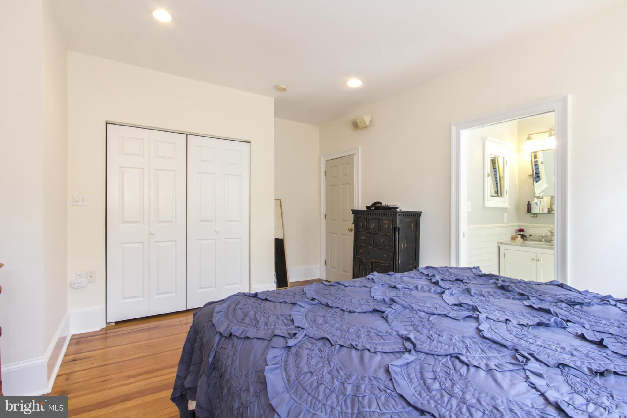 1423 R Street Northwest, Unit 505 Washington, DC 20009 - Photo 14 of 22 a bedroom with a bed and a dresser