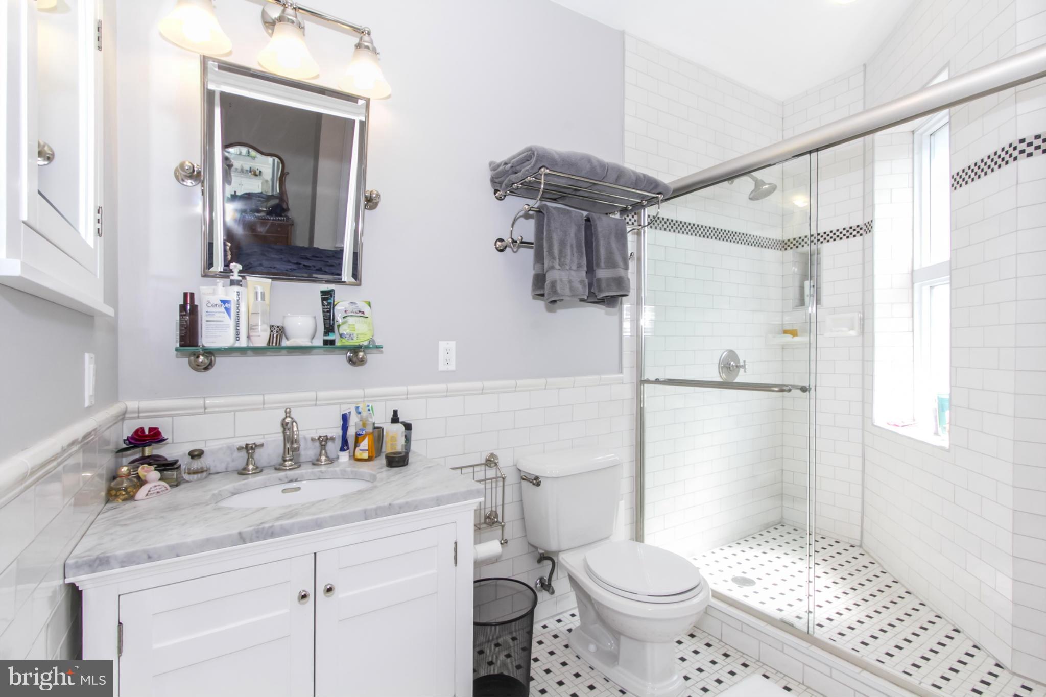 1423 R Street Northwest, Unit 505 Washington, DC 20009 - Photo 15 of 22 a bathroom with a sink toilet and shower