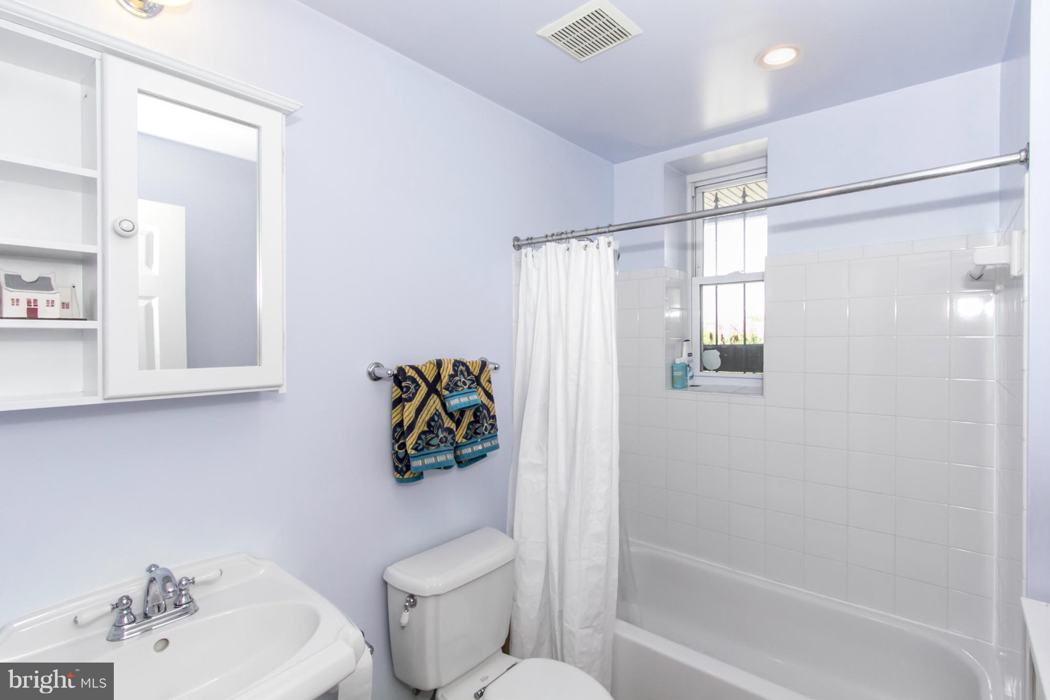1423 R Street Northwest, Unit 505 Washington, DC 20009 - Photo 19 of 22 a bathroom with a toilet sink and shower