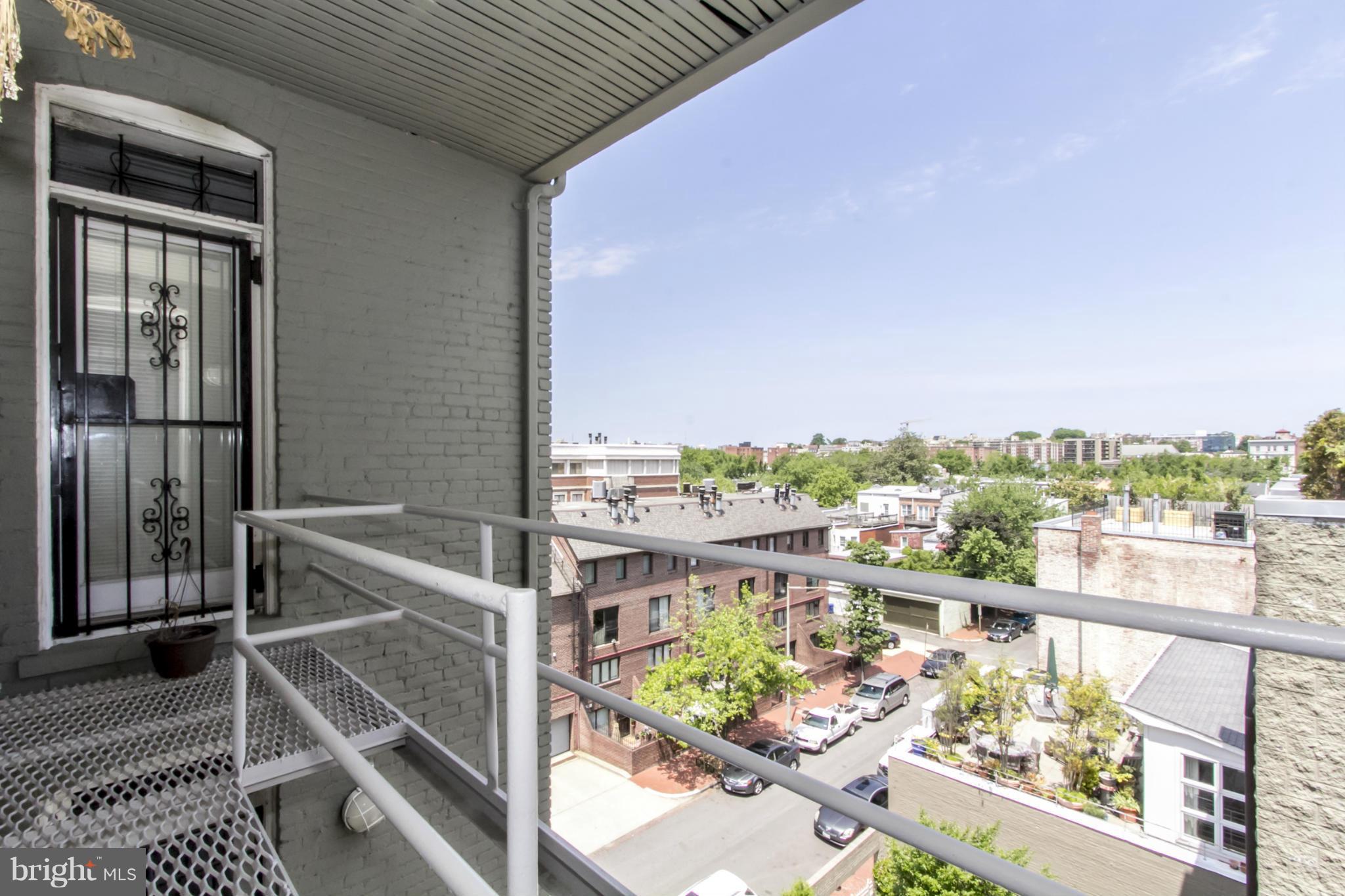 1423 R Street Northwest, Unit 505 Washington, DC 20009 - Photo 21 of 22 a view of a balcony with an outdoor seating