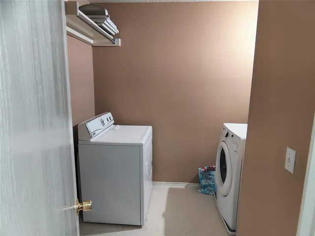 a utility room with a window dryer and washer