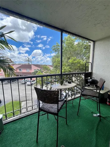 a view of a chairs in backyard of the house