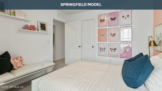 a bedroom with a bed and a couch