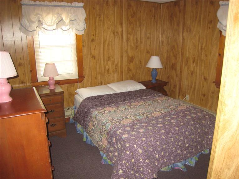 70 Captain Chase Road Dennis Port, MA 02639 - Photo 7 of 10 a bedroom with a bed and teddy bear on the dresser