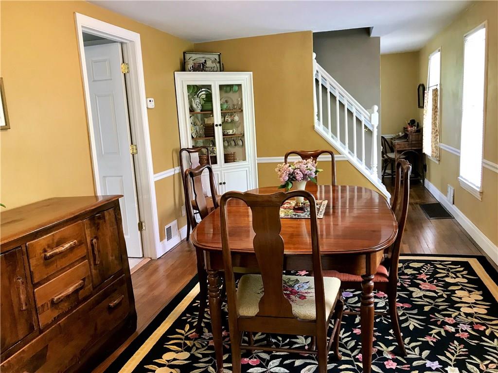 294 Idlewood Road Penn Hills, PA 15235 - Photo 5 of 25 Dining room has beautiful hardwood floors, corner built in and easy access to the 4th bedroom with full bath. Banister does detach to make it easier moving your larger items up to the second floor come moving day