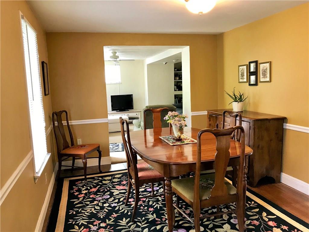294 Idlewood Road Penn Hills, PA 15235 - Photo 6 of 25 Dining room measures 14x10 with plenty of natural light, hardwood floors and chair rail.