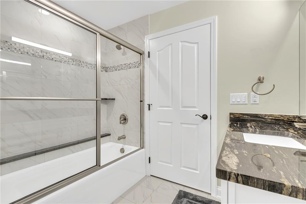 216 Adams Pointe Boulevard, Unit 8 Mars, PA 16046 - Photo 21 of 34 a bathroom with a tub and shower