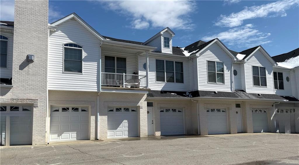 216 Adams Pointe Boulevard, Unit 8 Mars, PA 16046 - Photo 32 of 34 a front view of a house with a parking area