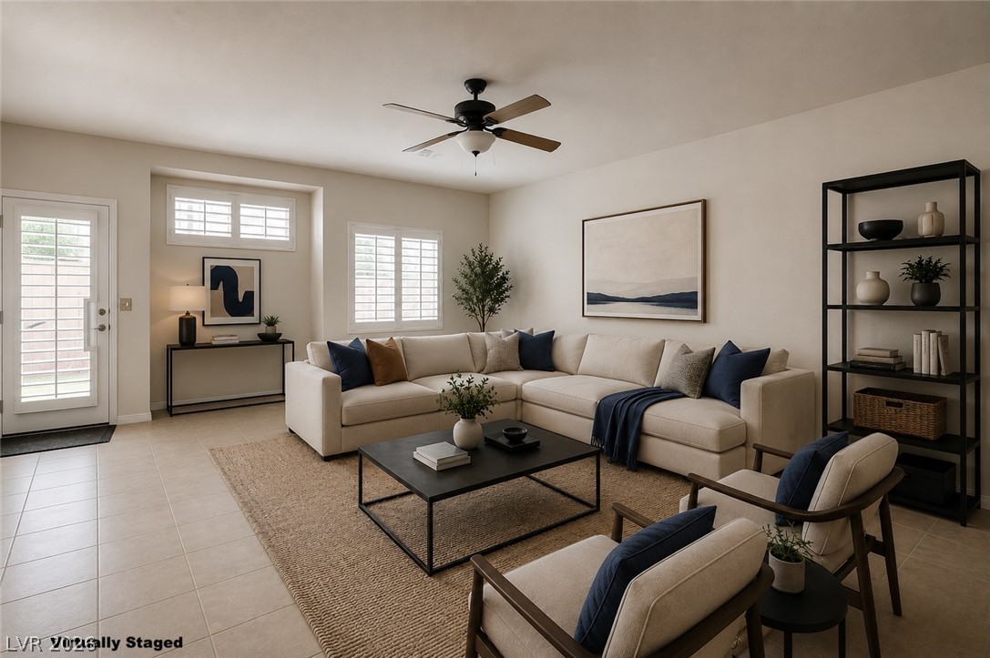 1479 Orange Jubilee Road Henderson, NV 89014 - Photo 1 of 36 A spacious living area with warm natural light, ideal for comfortable daily living and entertaining.