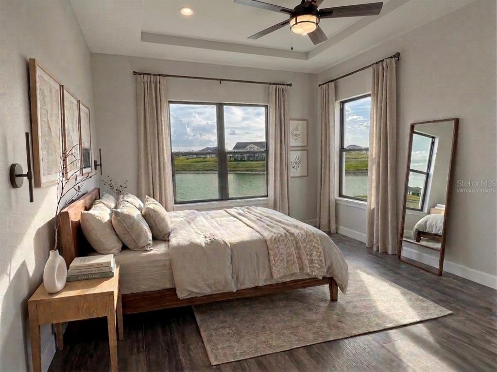224 Valencia Ridge Drive Auburndale, FL 33823 - Photo 20 of 39 a bedroom with a bed and wooden floor