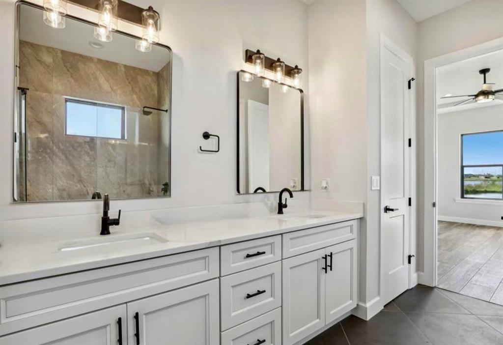 224 Valencia Ridge Drive Auburndale, FL 33823 - Photo 23 of 39 a bathroom with a sink and a mirror