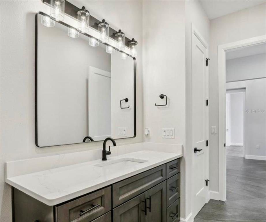 224 Valencia Ridge Drive Auburndale, FL 33823 - Photo 26 of 39 a bathroom with a sink and a mirror