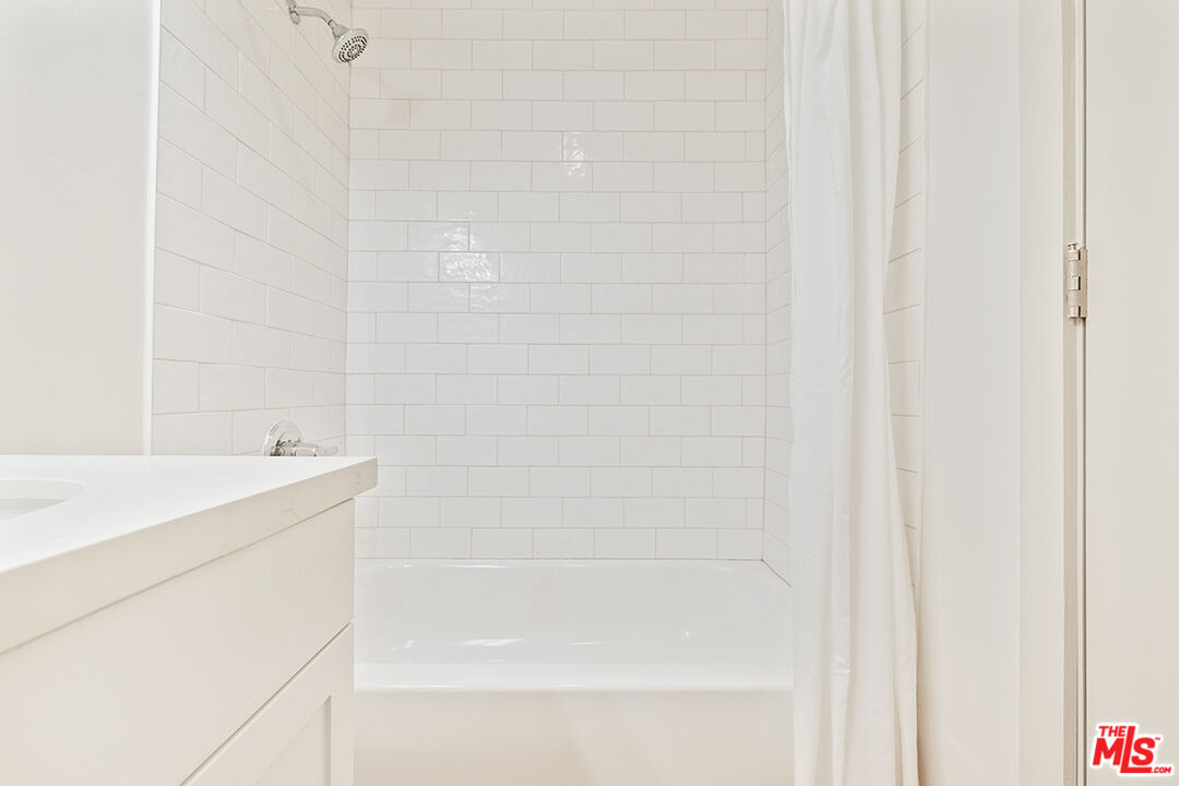 821 3rd Street, Unit 209 Santa Monica, CA 90403 - Photo 14 of 25 a bathroom with a shower and a sink