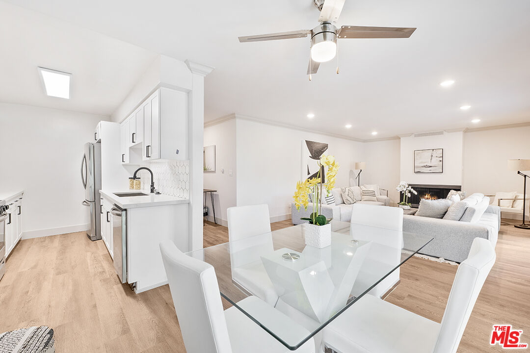 821 3rd Street, Unit 209 Santa Monica, CA 90403 - Photo 20 of 25 a living room with furniture and a kitchen view
