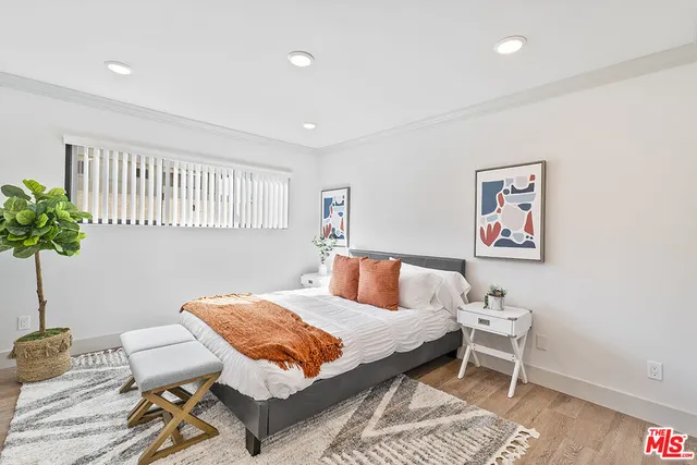 a bedroom with a bed and a table