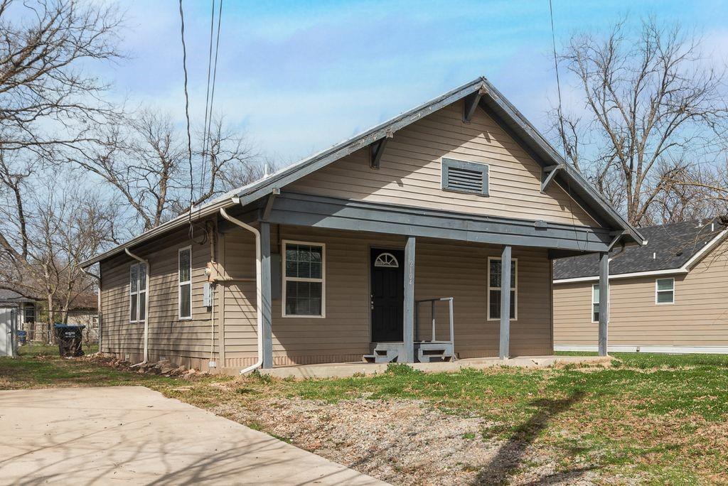 2104 Division Street Greenville, TX 75401 - Photo 1 of 1 a front view of a house with a yard