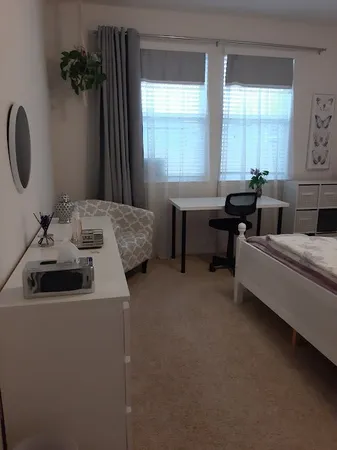 a en suite bathroom with a sink and a mirror