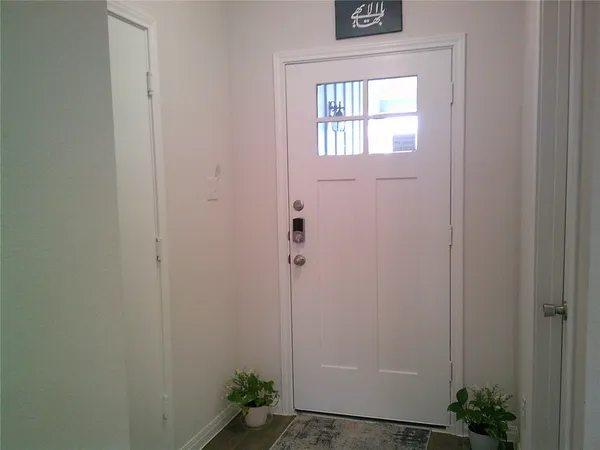 a view of a bathroom that has a window in it