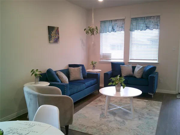 a living room with furniture and window