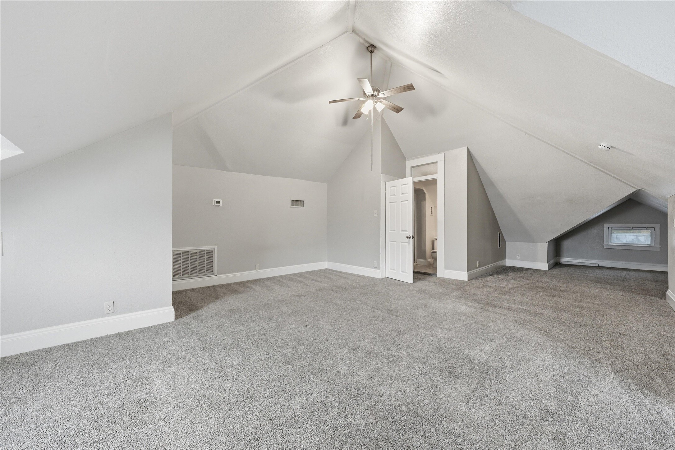 803 North 3rd Street Temple, TX 76501 - Photo 15 of 22 an empty room with a ceiling fan and a window