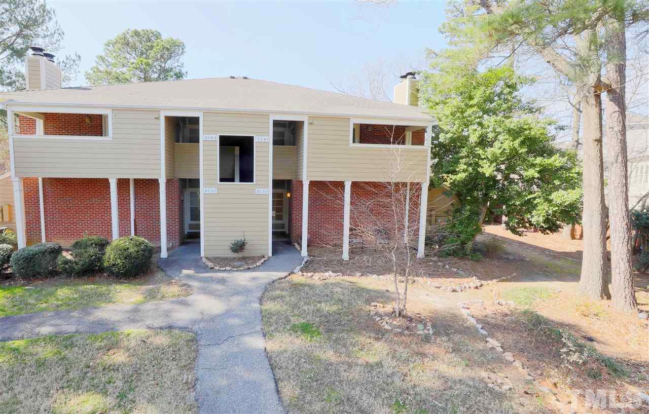 3533 Mill Run, Unit N/A Raleigh, NC 27612 - Photo 1 of 19 a front view of a house with garden