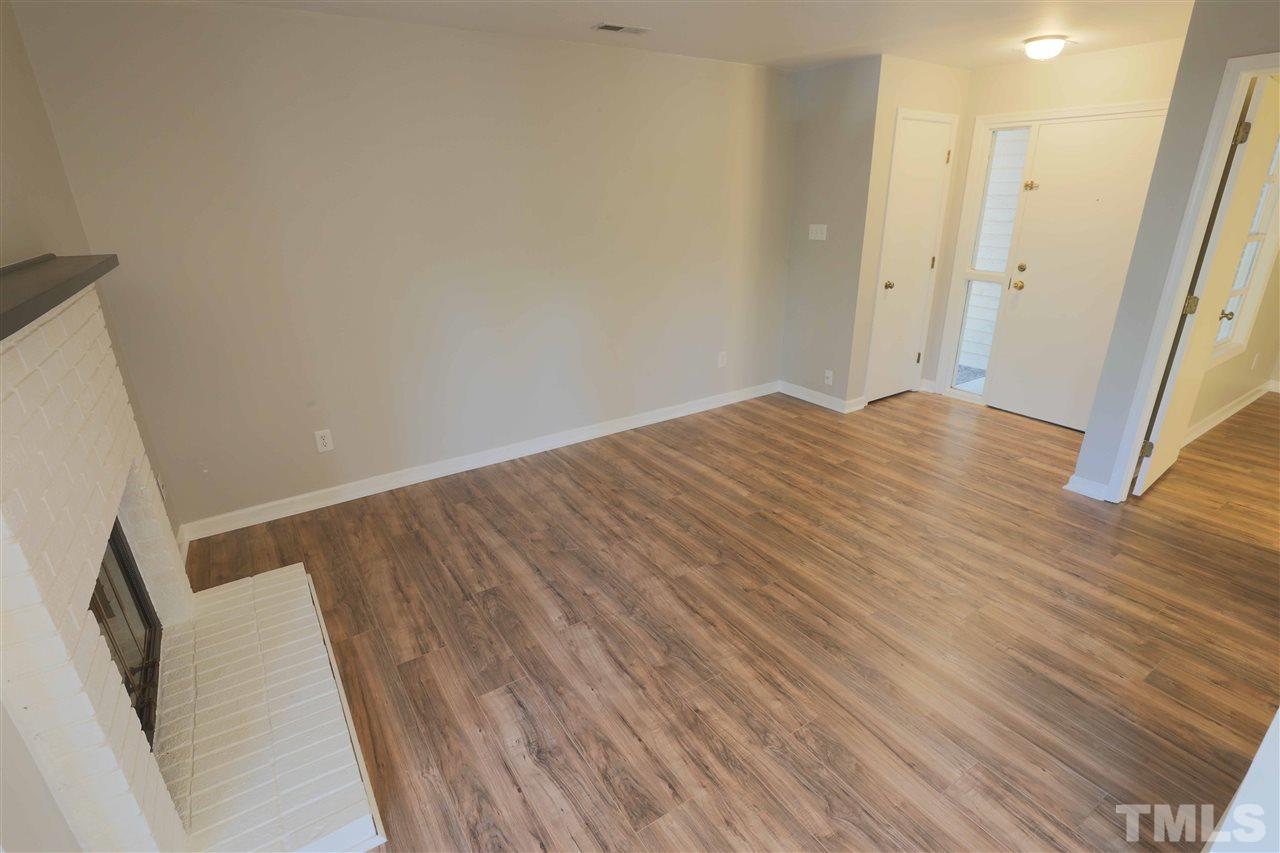 3533 Mill Run, Unit N/A Raleigh, NC 27612 - Photo 5 of 19 a view of empty room with wooden floor