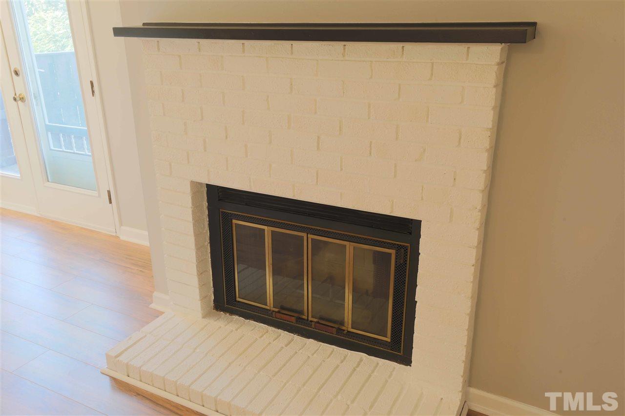 3533 Mill Run, Unit N/A Raleigh, NC 27612 - Photo 6 of 19 a view of a small space with wooden floor and a window
