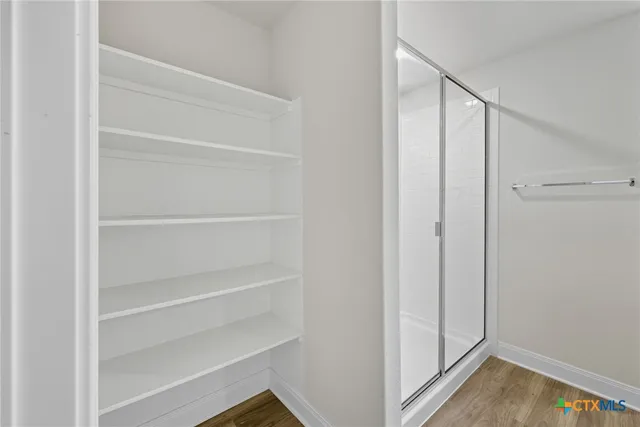 a bathroom with a double vanity sink and mirror