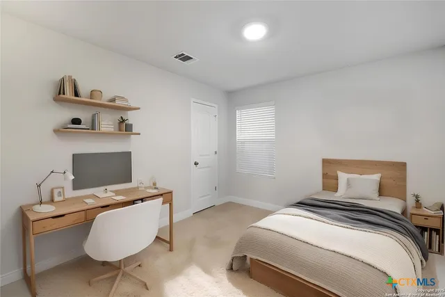 a bedroom with a bed and a window