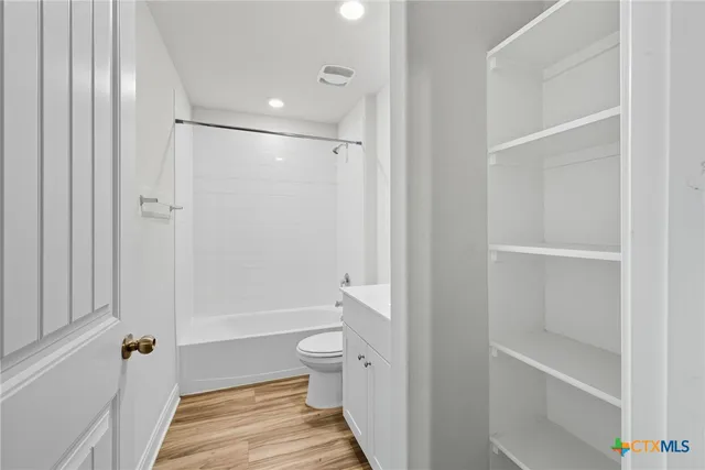 a bathroom with a sink a toilet and a bathtub