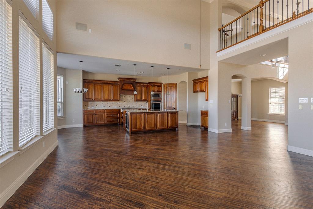 2207 Galloway Boulevard Trophy Club, TX 76262 - Photo 12 of 36 a view of a living room with kitchen and fireplace