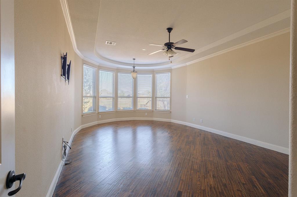 2207 Galloway Boulevard Trophy Club, TX 76262 - Photo 13 of 36 a view of an empty room with wooden floor and a window