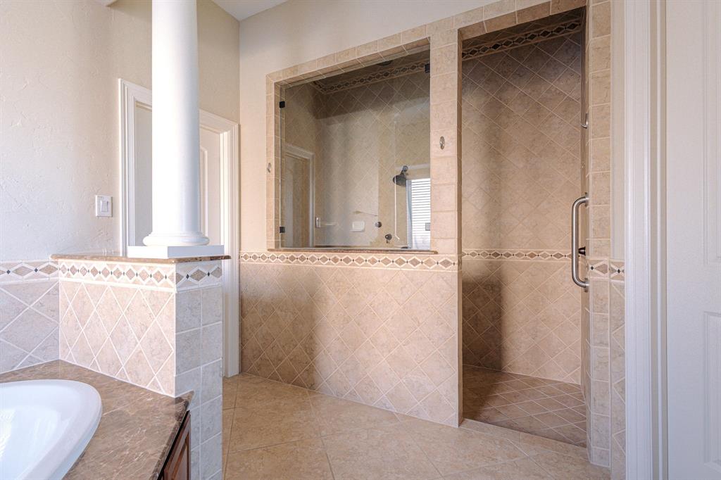 2207 Galloway Boulevard Trophy Club, TX 76262 - Photo 18 of 36 a bathroom with a granite countertop sink and a mirror