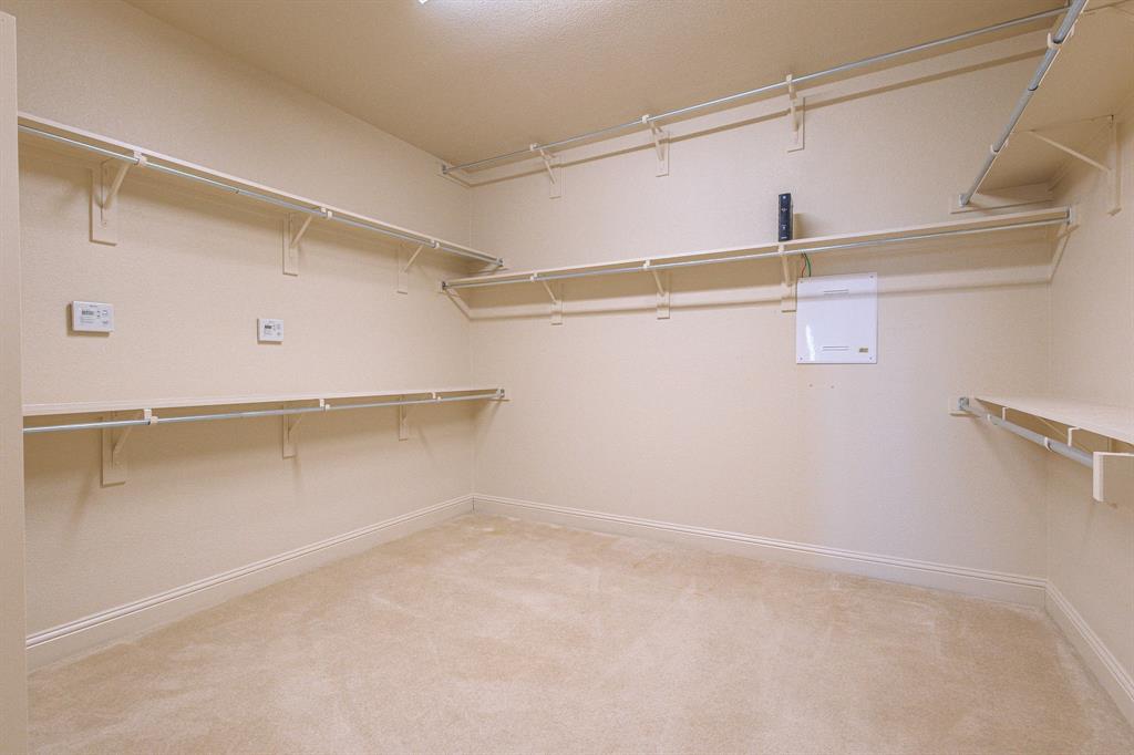 2207 Galloway Boulevard Trophy Club, TX 76262 - Photo 19 of 36 a view of a room with racks on the wall