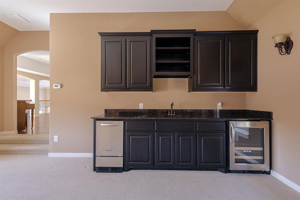 2207 Galloway Boulevard Trophy Club, TX 76262 - Photo 31 of 36 a kitchen with stainless steel appliances a stove and cabinets